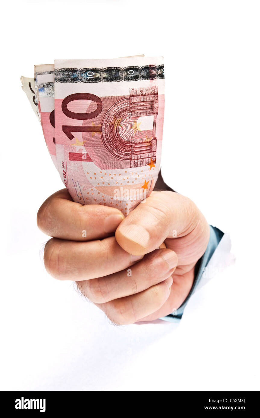 Faust mit Geld brach Papier Stockfoto