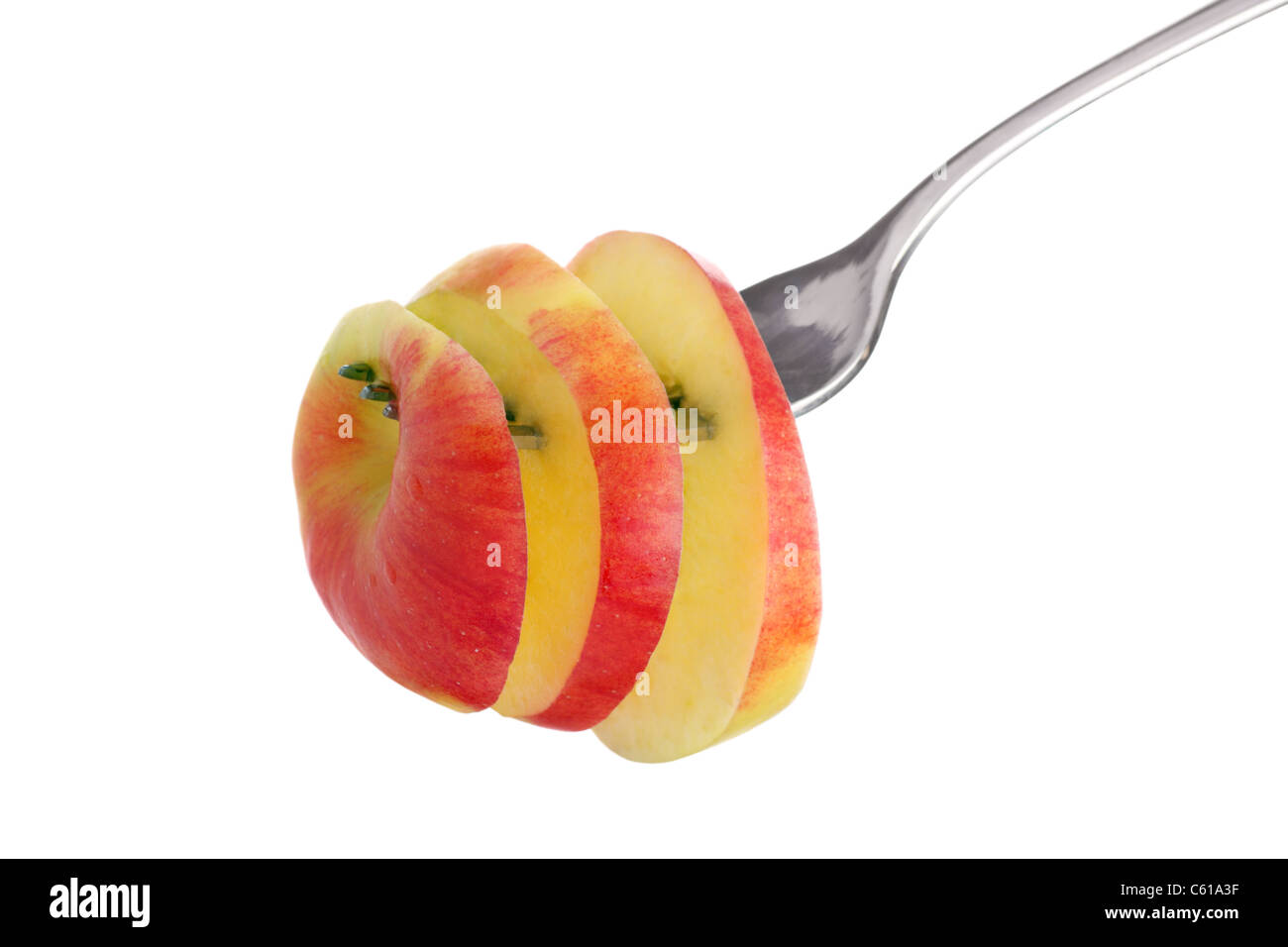 Köstliche geschnittenen Apfel auf einer Gabel, isoliert auf weißem Hintergrund Stockfoto