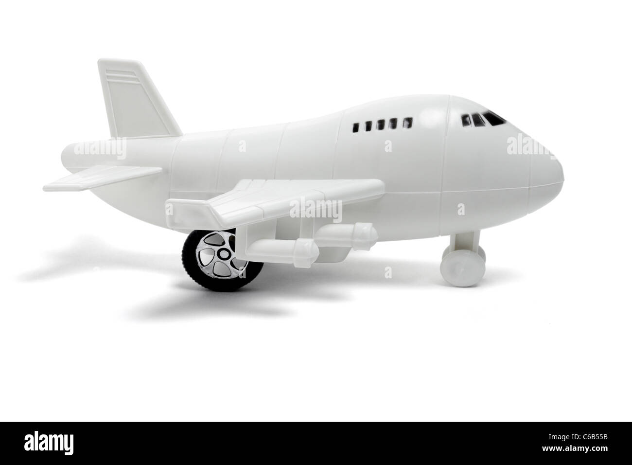 Plastikspielzeug Jet Passagierflugzeug auf weißem Hintergrund Stockfoto