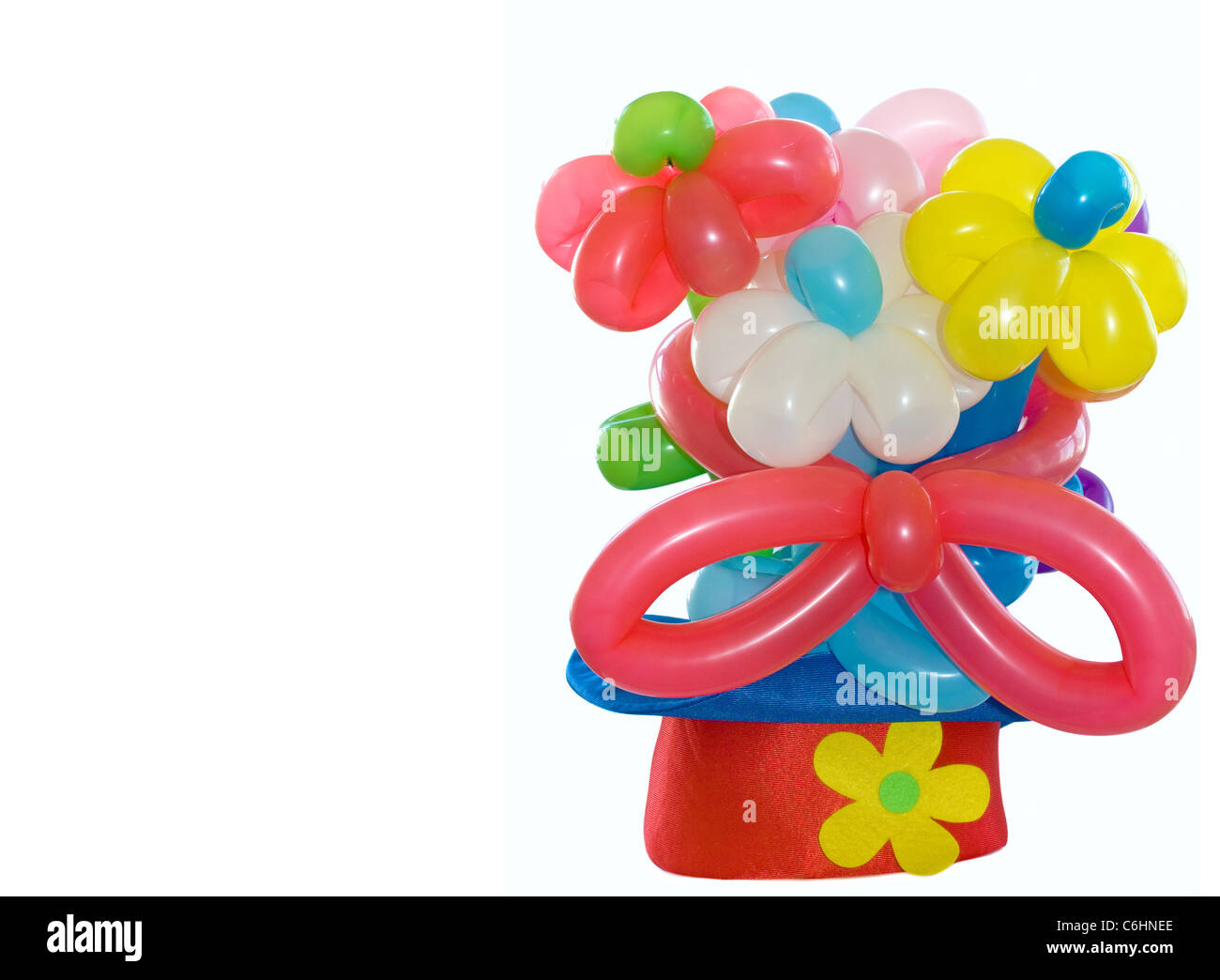 Ballons Blumen in einem Clown Hut Stockfoto