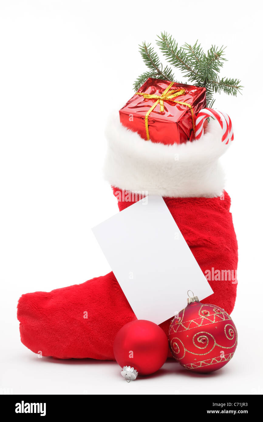 Gefüllte Weihnachts-Strumpf mit leeren Karte Stockfoto