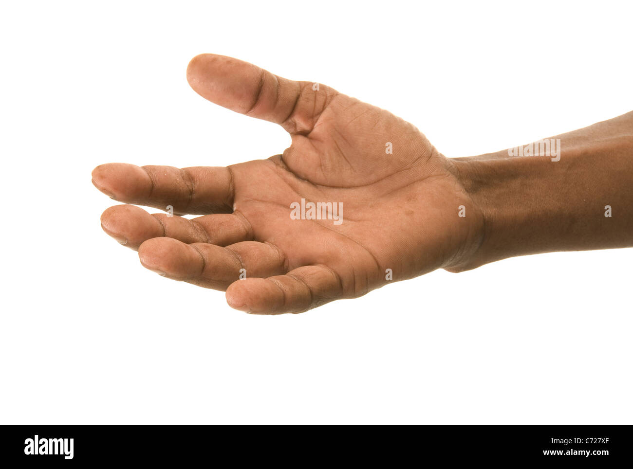African's hand, erweiterte in Freundschaft oder Fragen nach Essen, Geld oder Hilfe. Stockfoto