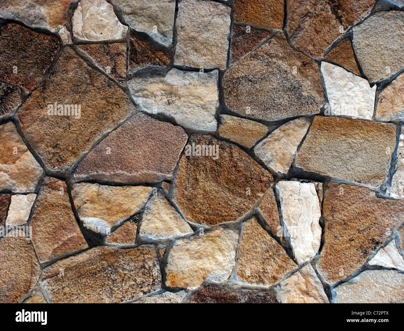 Zusammenfassung Hintergrund: Wand aus Steinen Stockfoto