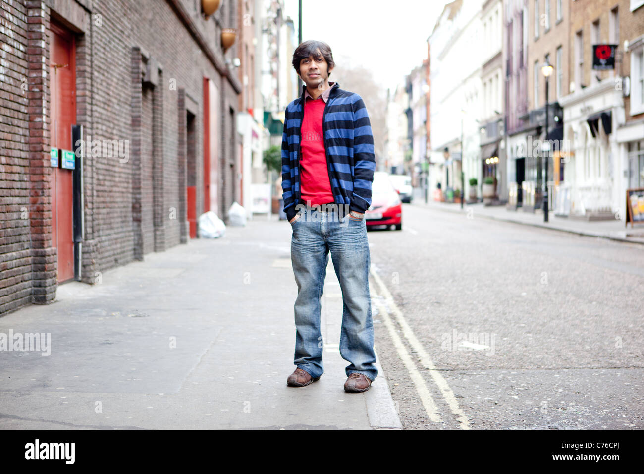 Junger Mann in Soho, London Stockfoto