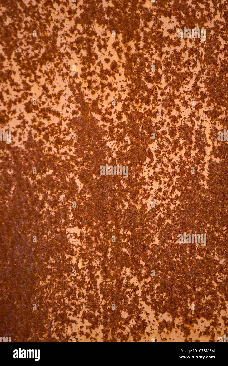 Ein verrostetes Metall Textur mit einem orangefarbenen Ton. Stockfoto