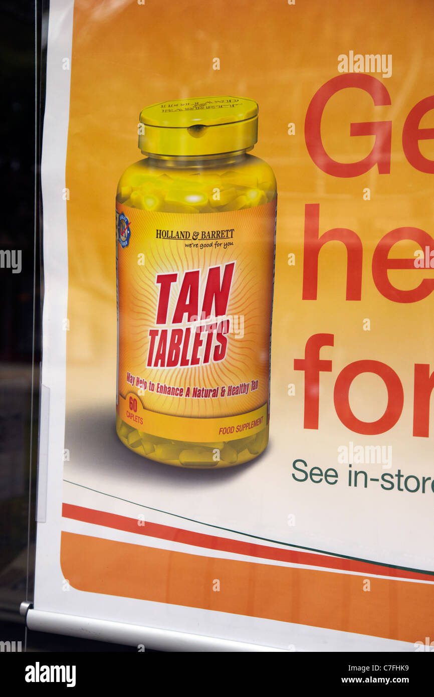 Bräunen Tabletten zum Verkauf in Holland und Barrett-Gesundheits-Shop, UK. Stockfoto