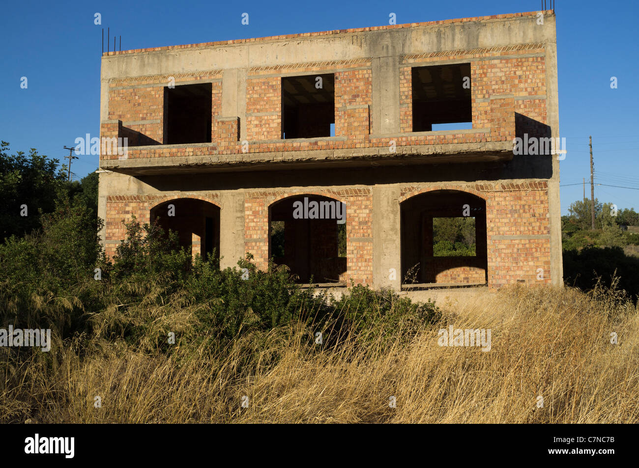 Eine unvollendete und verlassenen Block von Ferienwohnungen aufgrund der griechischen Finanzkrise in Agios Nikolaos, Crete Stockfoto