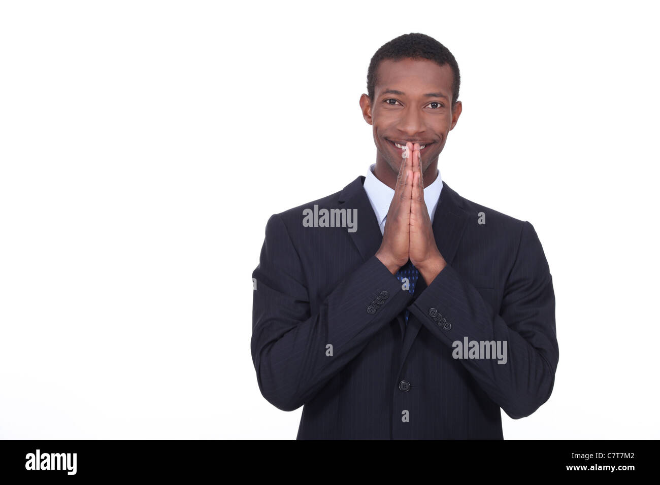 Afrikanischen Geschäftsmann in der Hoffnung auf gute Nachrichten Stockfoto