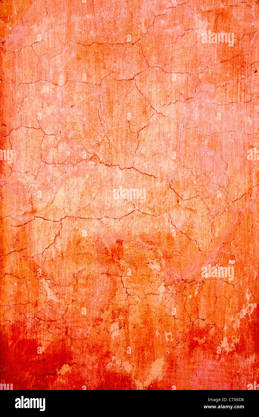 Grunge Wand rissig Textur in orange roten Farben Stockfoto