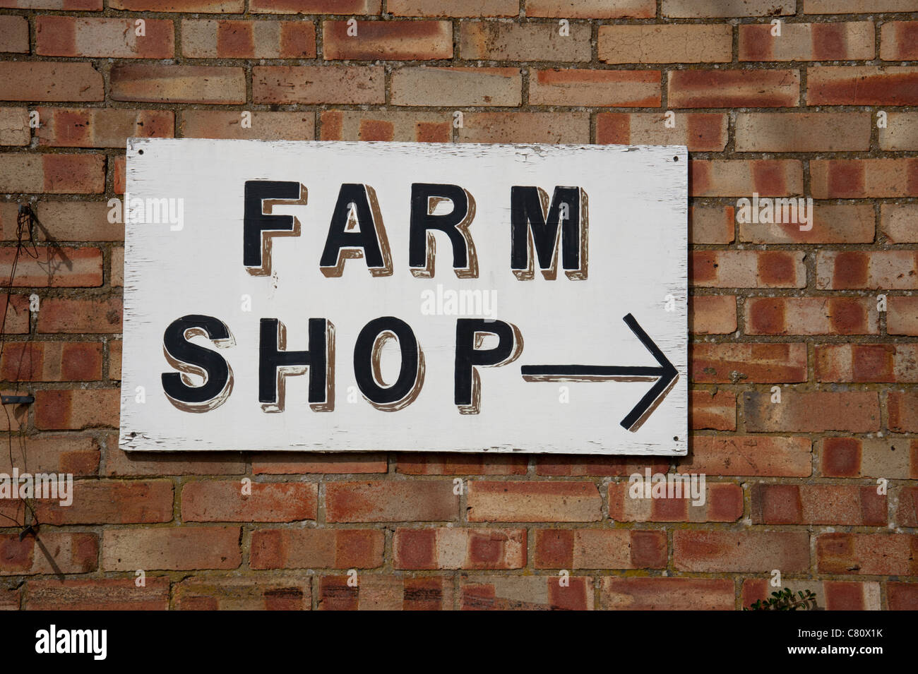 Bauernhof Shop Zeichen handgemalt auf Mauer. Stockfoto