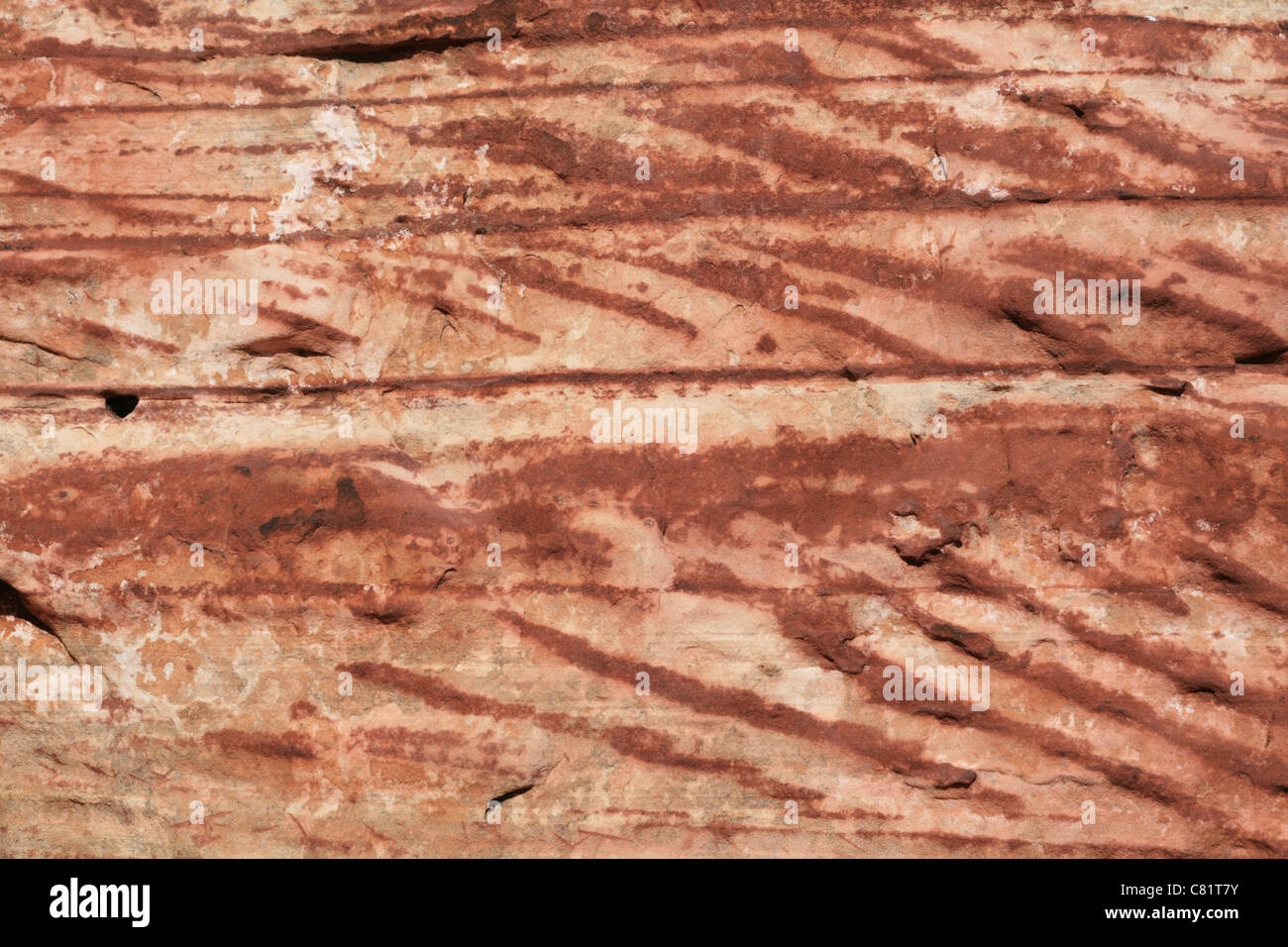 rot und braun Kreuz gebettet Sandstein Hintergrundtextur Stockfoto