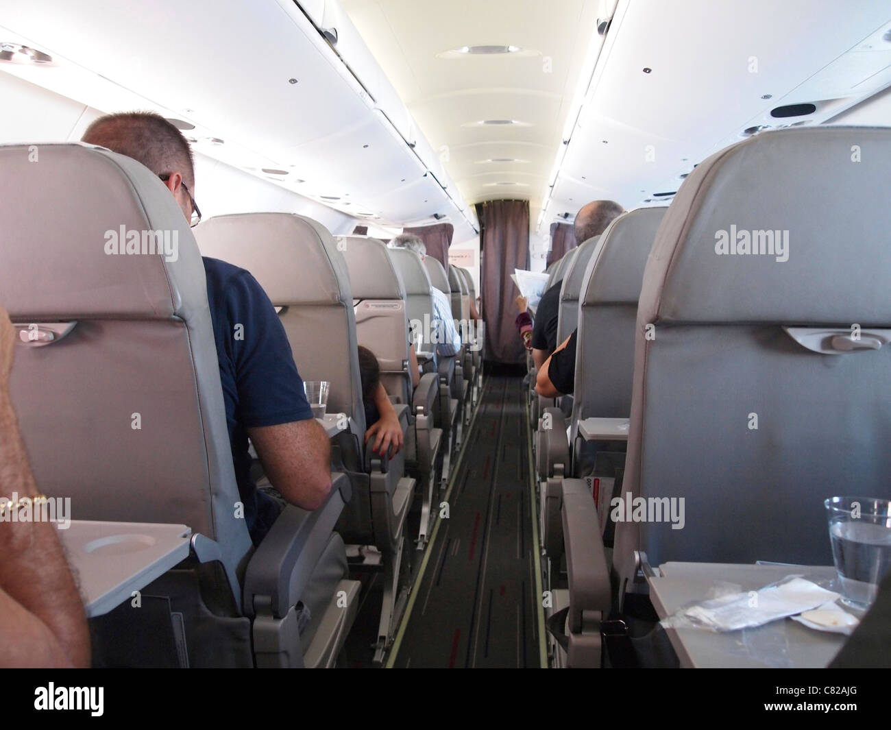 Flugzeug-Passagiere im Flugzeug Stockfoto