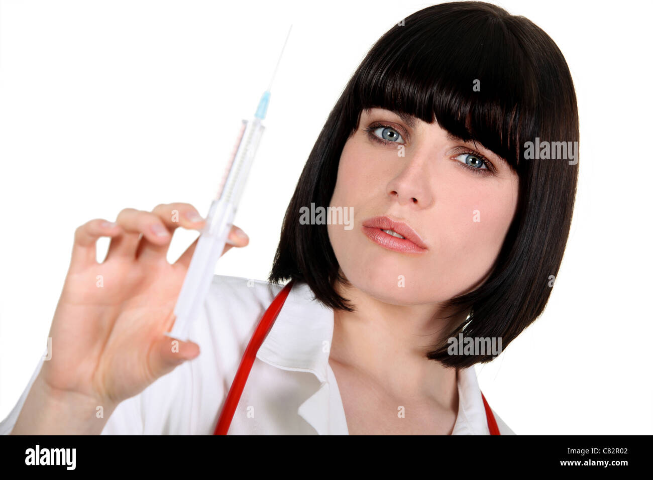 Krankenschwester mit Helm Haarschnitt mit Spritze Stockfoto