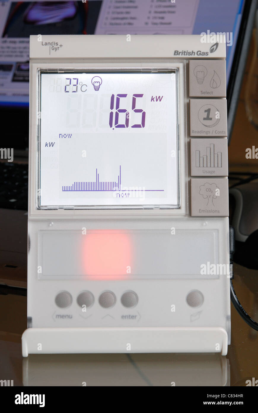 Inländische British Gas Smart Meter im "Strom"-Modus, mit gelbes Licht Durchschnittsverbrauch anzeigt. GROßBRITANNIEN 2011. Stockfoto