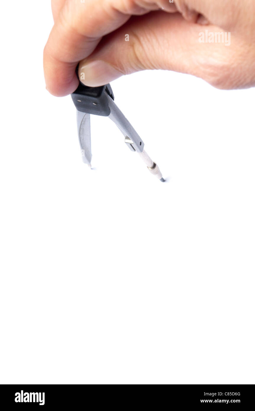 Hand hält einen Kompass für technisches zeichnen Stockfoto