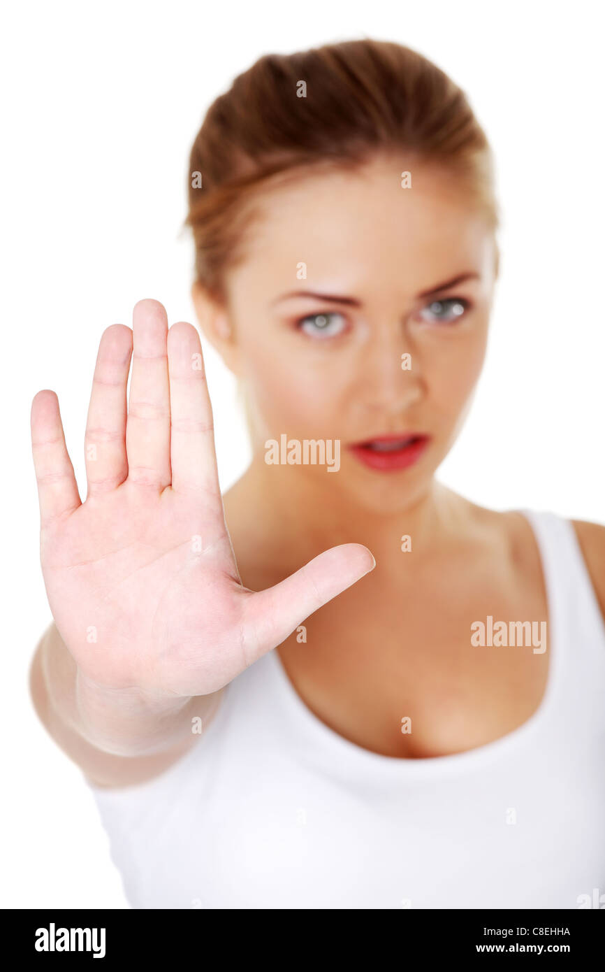 Junge hübsche kaukasische Mädchen zeigt Stop Geste auf weißem Hintergrund. Stockfoto