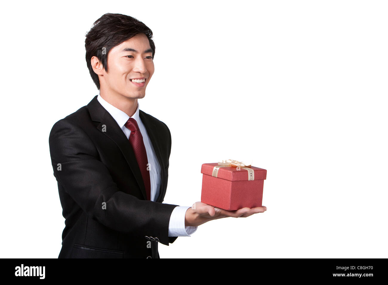Geschäftsmann hält ein Geschenk Stockfotografie - Alamy