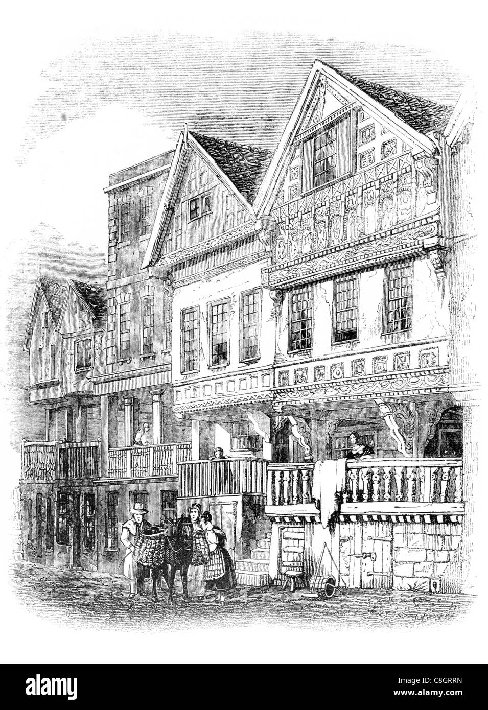 Alte Häuser gedeckt Chester Zeilen Zeile Gehweg Erdgeschoss Eingang Geschäfte Shop Einzelhandel Cheshire England Mittelalter Touristen anzuziehen Stockfoto