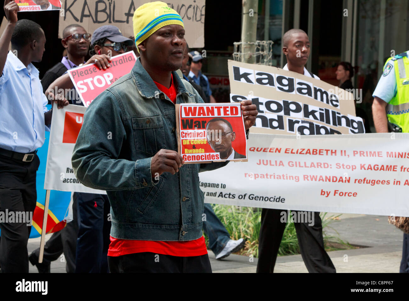 Demonstranten gegen ruandische Präsident Paul Kagame CHOGM 2011 demonstriert. Stockfoto