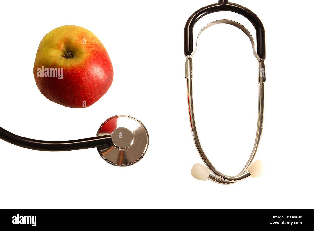 Stethoskop mit Apple auf einem Tisch steht für gesunde Ernährung 2 Stockfoto