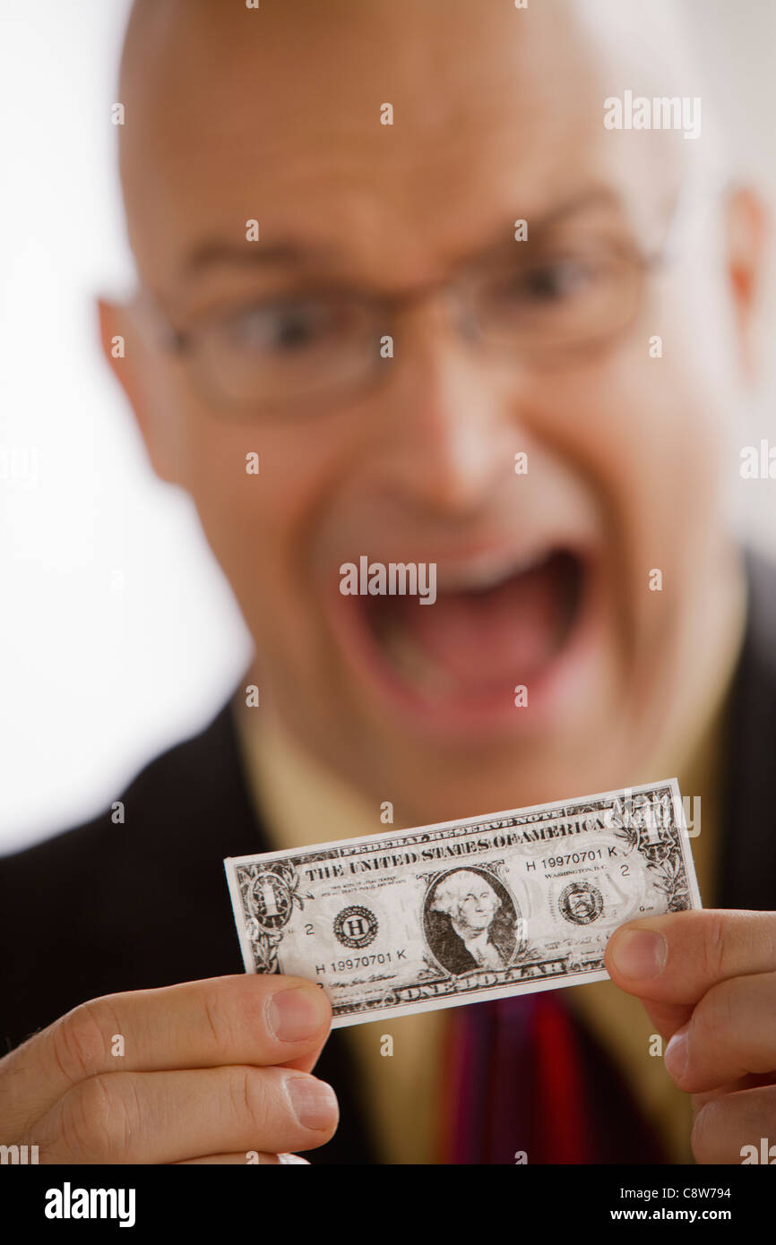 Porträt der Geschäftsmann mit einem Dollarschein Stockfoto