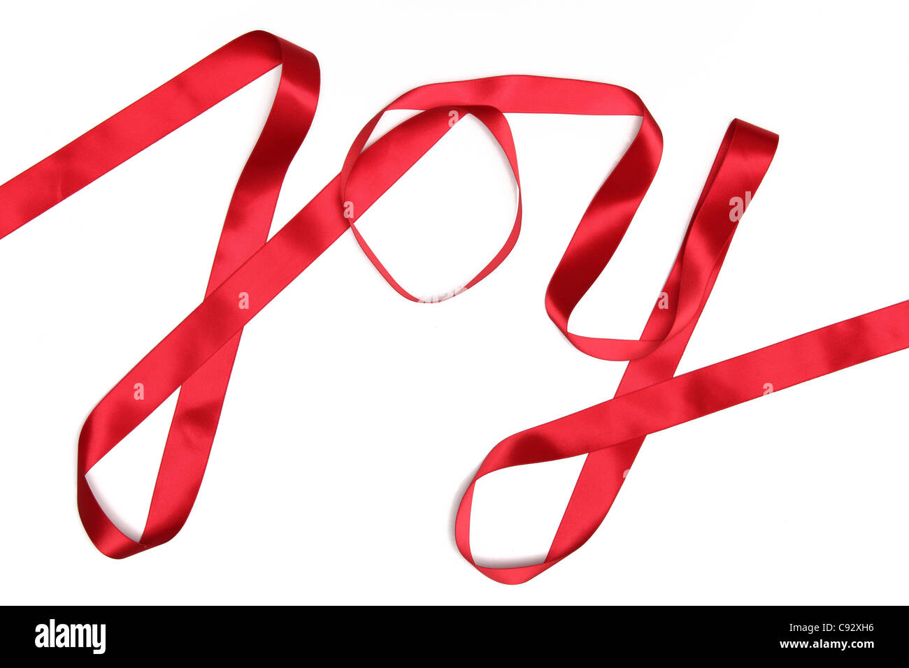 Freude Wort geschrieben in rotes Band auf weißem Hintergrund Stockfoto