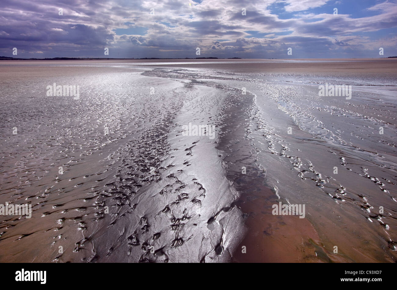 Gezeiten Sie Muster auf dem Sand am Titchwell Beach bei stürmischem Wetter Norfolk Stockfoto