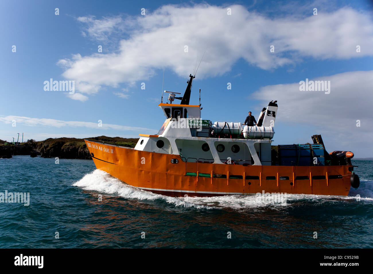 Dun eine Oir II - Fähre, die südlichste bewohnte Insel Cape Clear Island, Irland, vor der Küste von Co. Cork angekommen Stockfoto