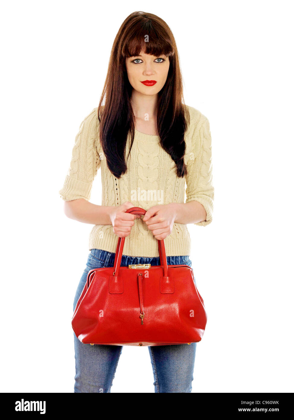 Junge Frau mit einem roten Handtasche. Model Released Stockfoto