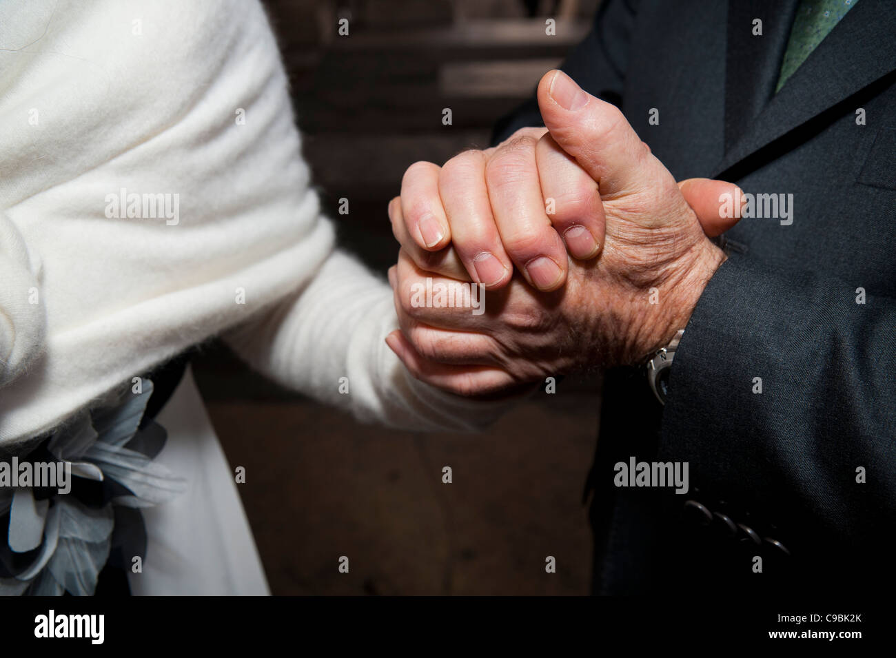 Halten die Hände im support Stockfoto