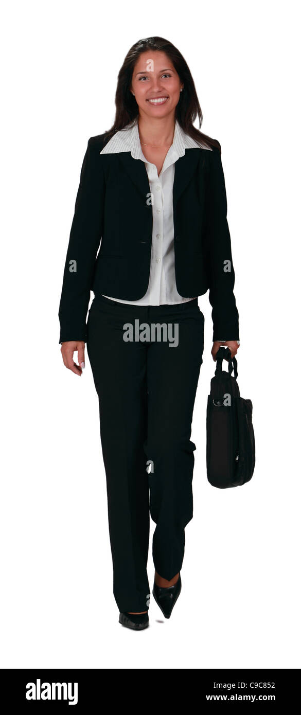 Junge Geschäftsfrau zu Fuß durch die Kamera vor einem weißen Hintergrund isoliert. Stockfoto