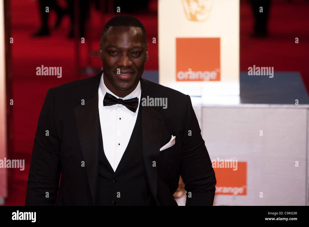 London, UK, 02.12.2012. Schauspieler, Adewale Akinnuoye-Agbaje, Ankunft auf den roten Teppichen in den BAFTAs 2012 Stockfoto