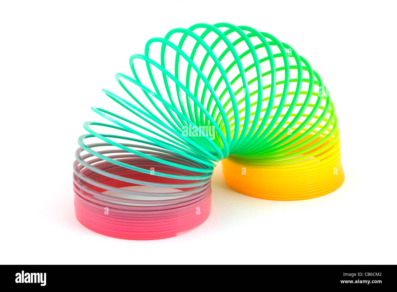 Slinky Spielzeug isoliert auf weiss Stockfoto