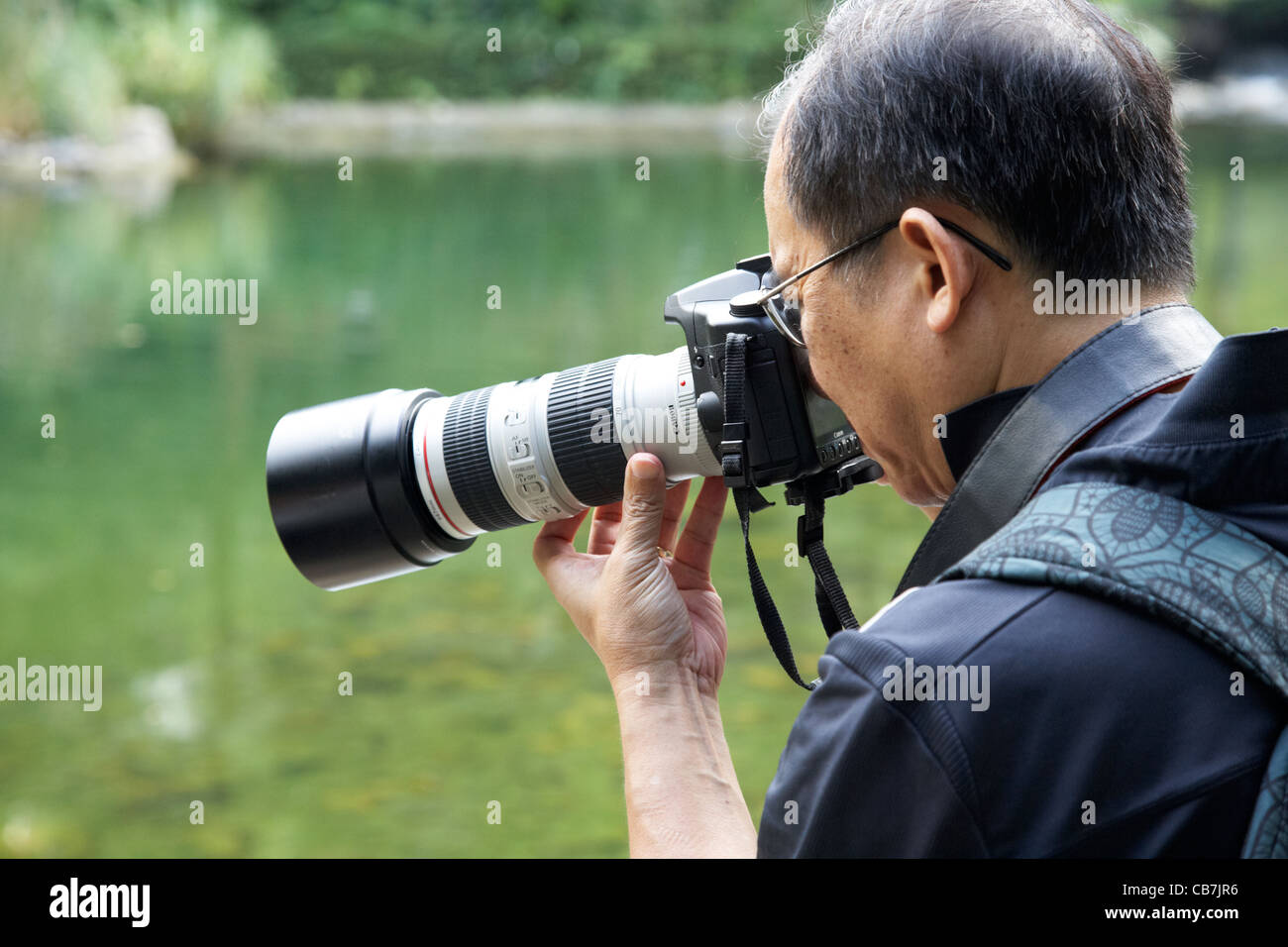 männlichen chinesischen Fotografen fotografieren mit Canon Kamera Insel  Hongkong, Sonderverwaltungsregion Hongkong, china Stockfotografie - Alamy
