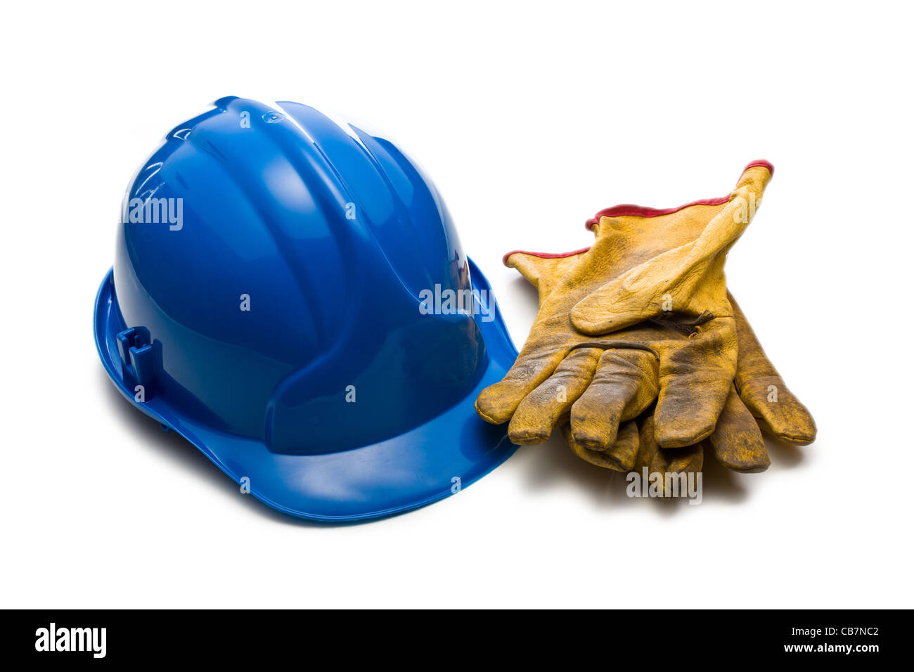 der blaue Helm und Leder Arbeitshandschuhe Stockfoto