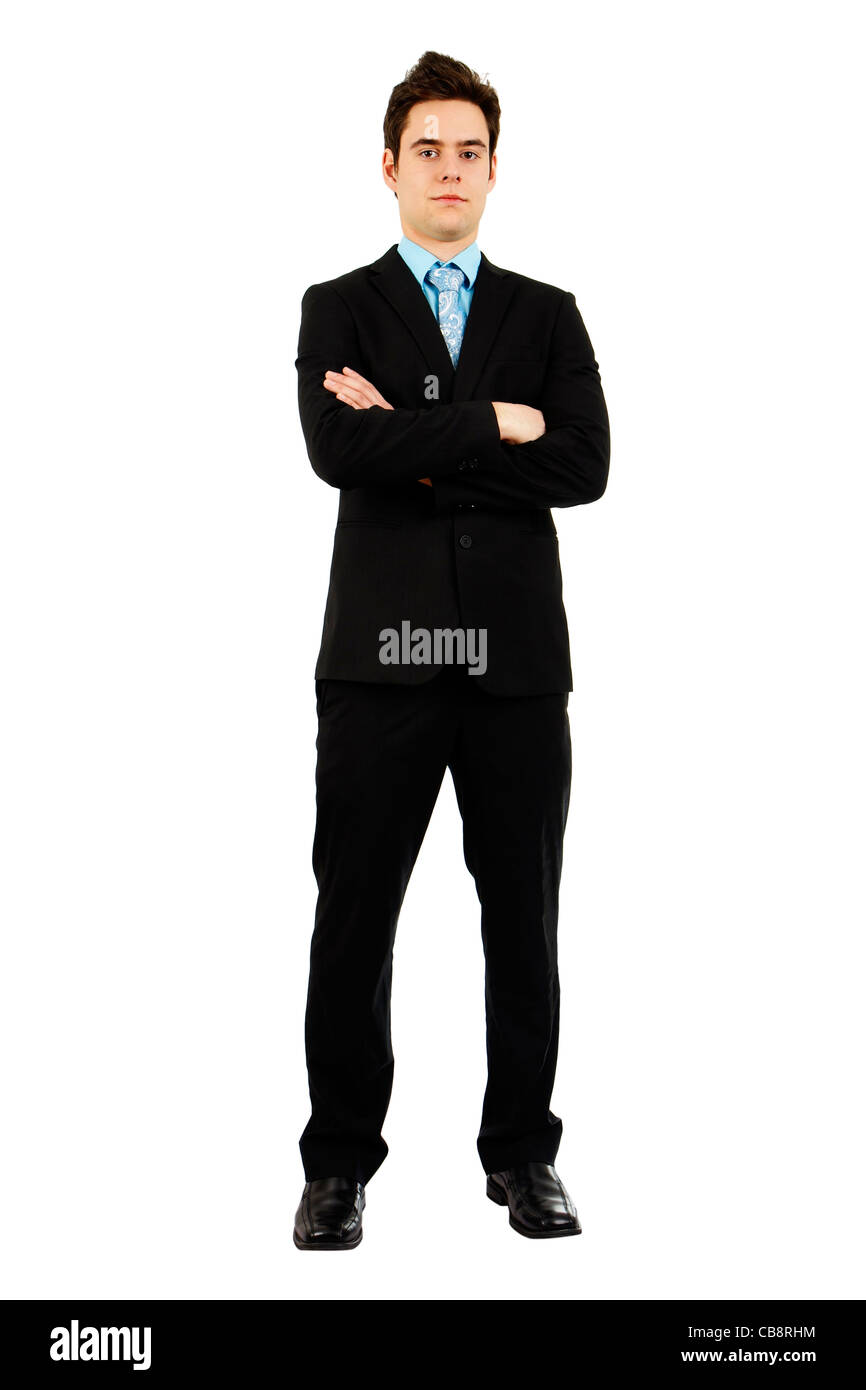 Ganzkörper Schuss ein hübscher zuversichtlich ernst junger Mann im Business Anzug mit verschränkten Armen. Stockfoto