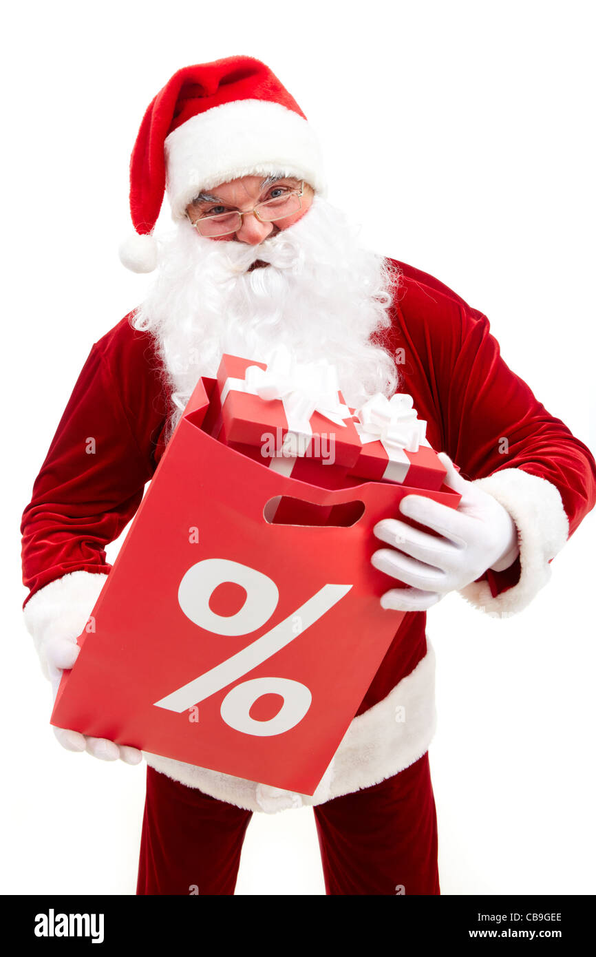 Foto von happy Santa Claus mit roten Paket voll mit giftboxes Stockfoto
