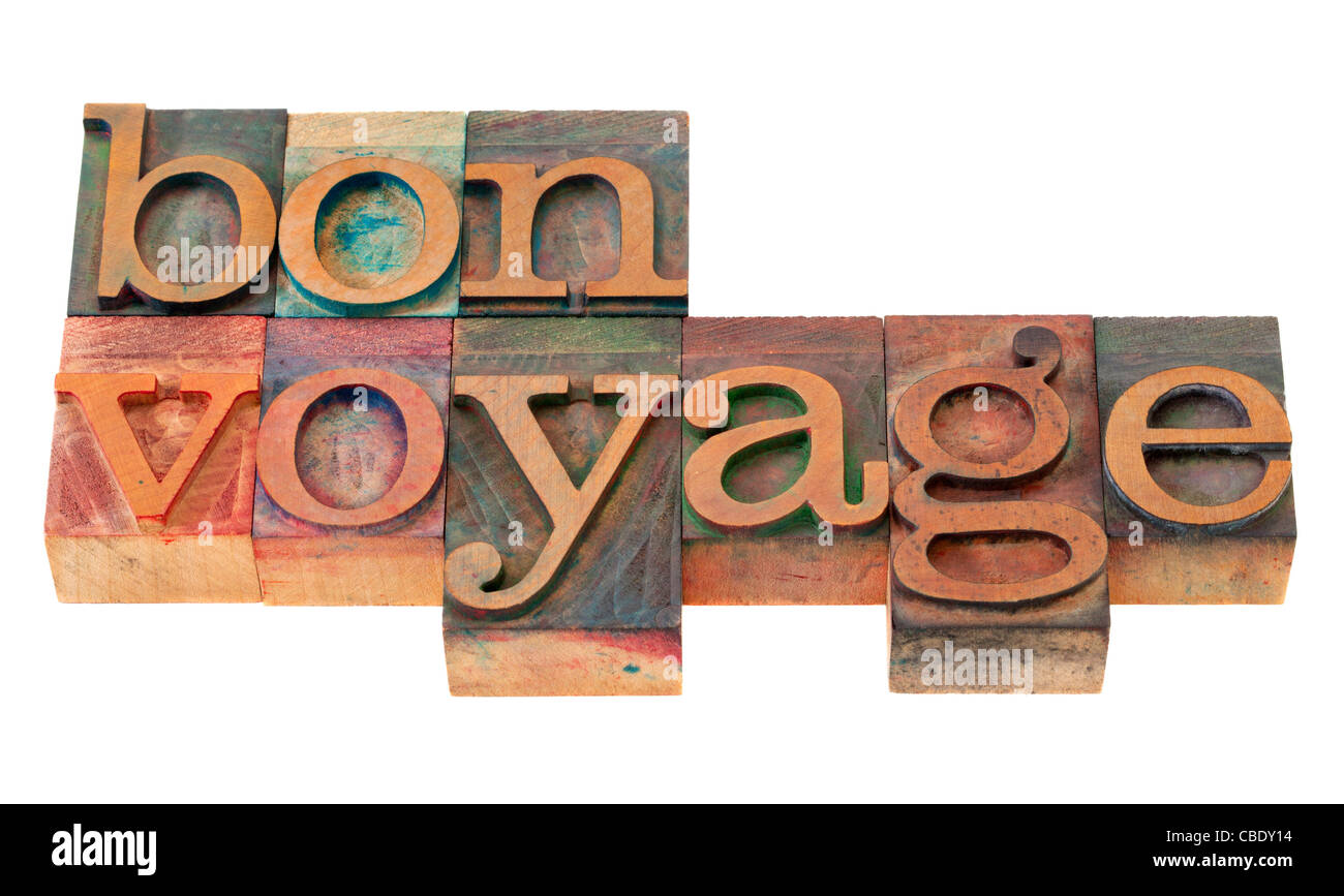 Travel Concept - bon voyage Satz in Vintage Holz Buchdruck Druckstöcken, befleckt durch Farbe Tinten, isoliert auf weiss Stockfoto