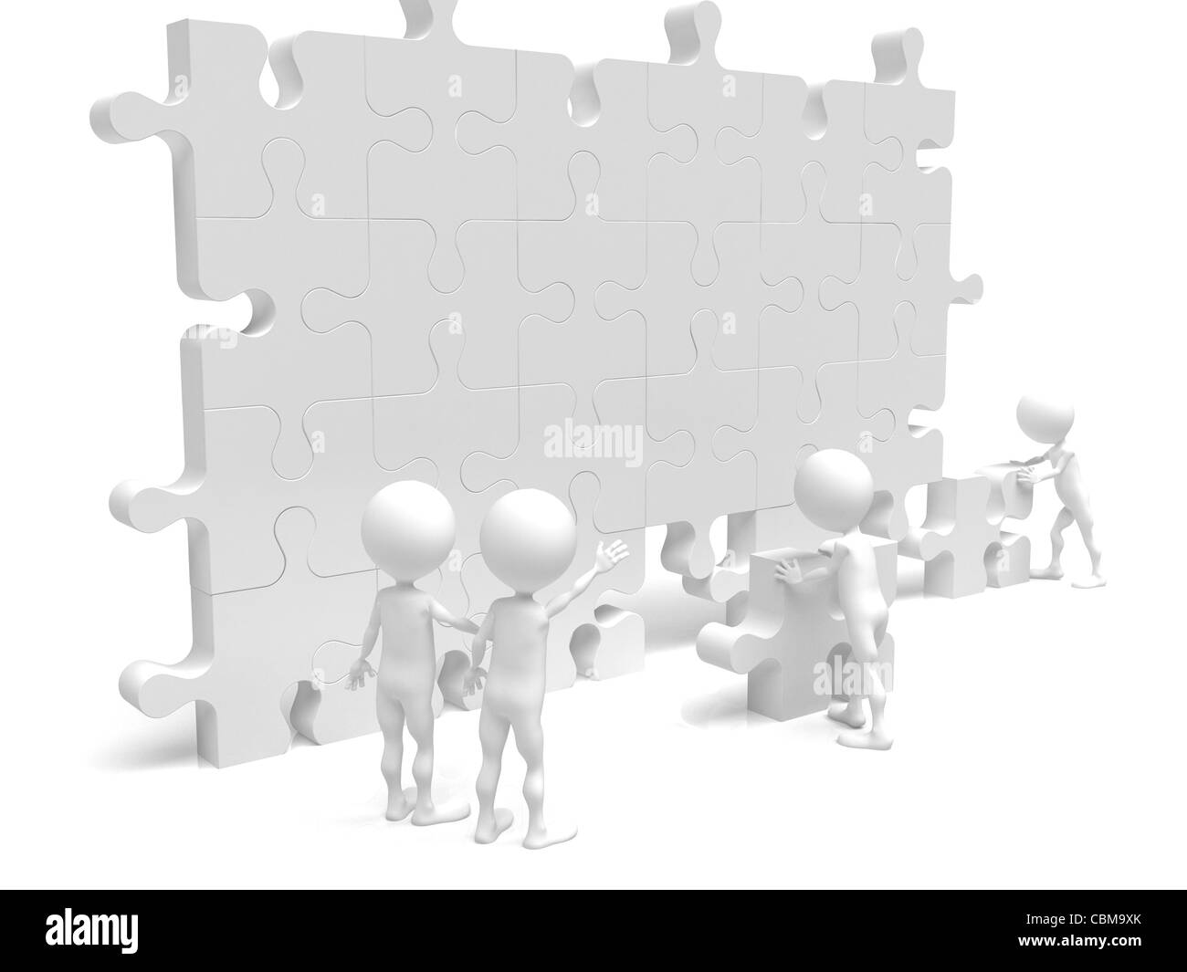 Business Teamarbeit beim Bau eines Puzzles Stockfoto