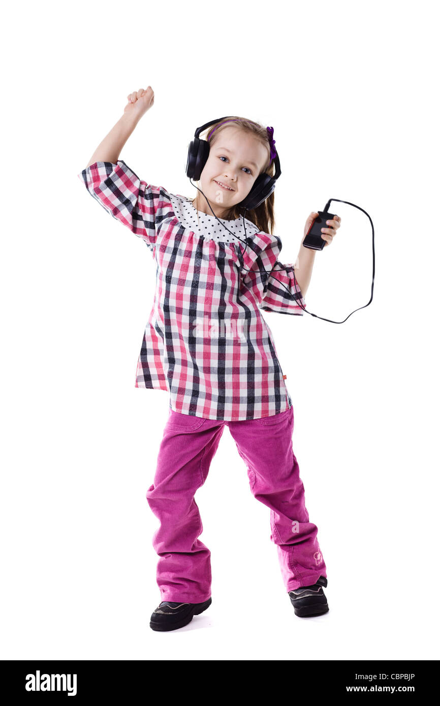 Das kleine Mädchen hört Musik und Tänze Stockfoto