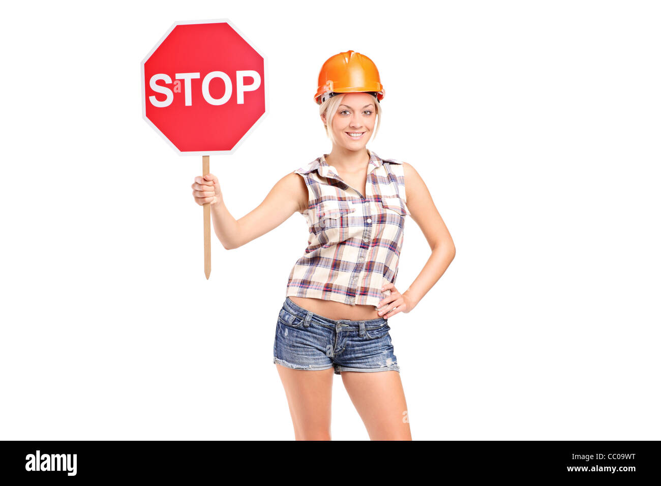 Ein Bauarbeiter mit einer Verkehrskontrolle Zeichen Stockfoto