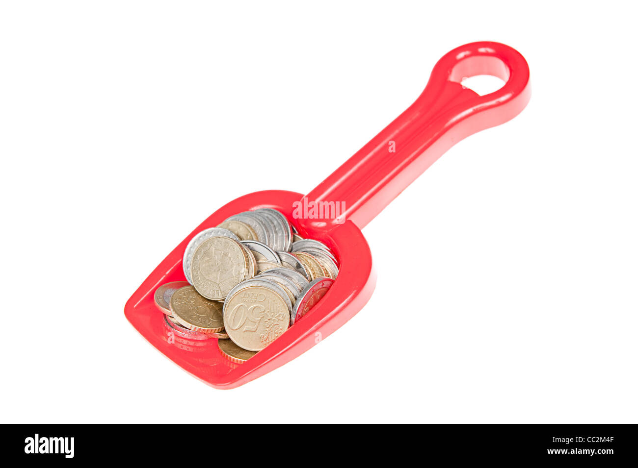 Spielzeug Schaufel gefüllt mit Euro-Münzen Stockfoto