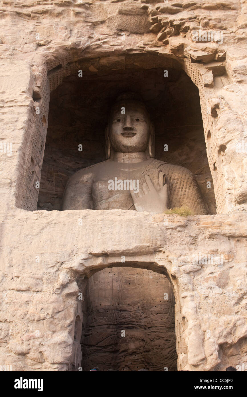 Buddha-Statue in einer Höhle, Yungang Grotten, Datong, Shanxi, China Stockfoto