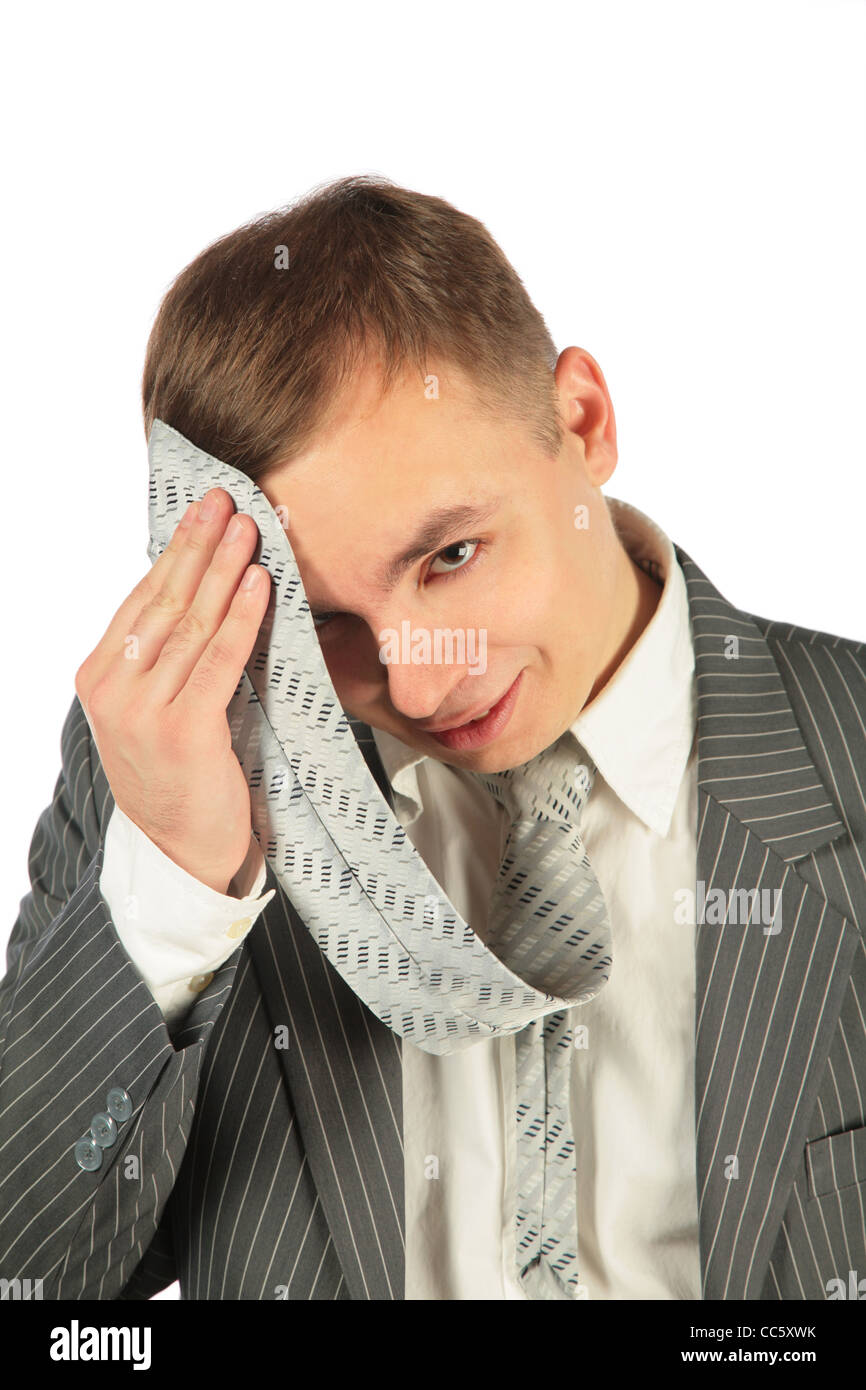 Müde Mann mit Krawatte auf weißem Hintergrund Stockfoto