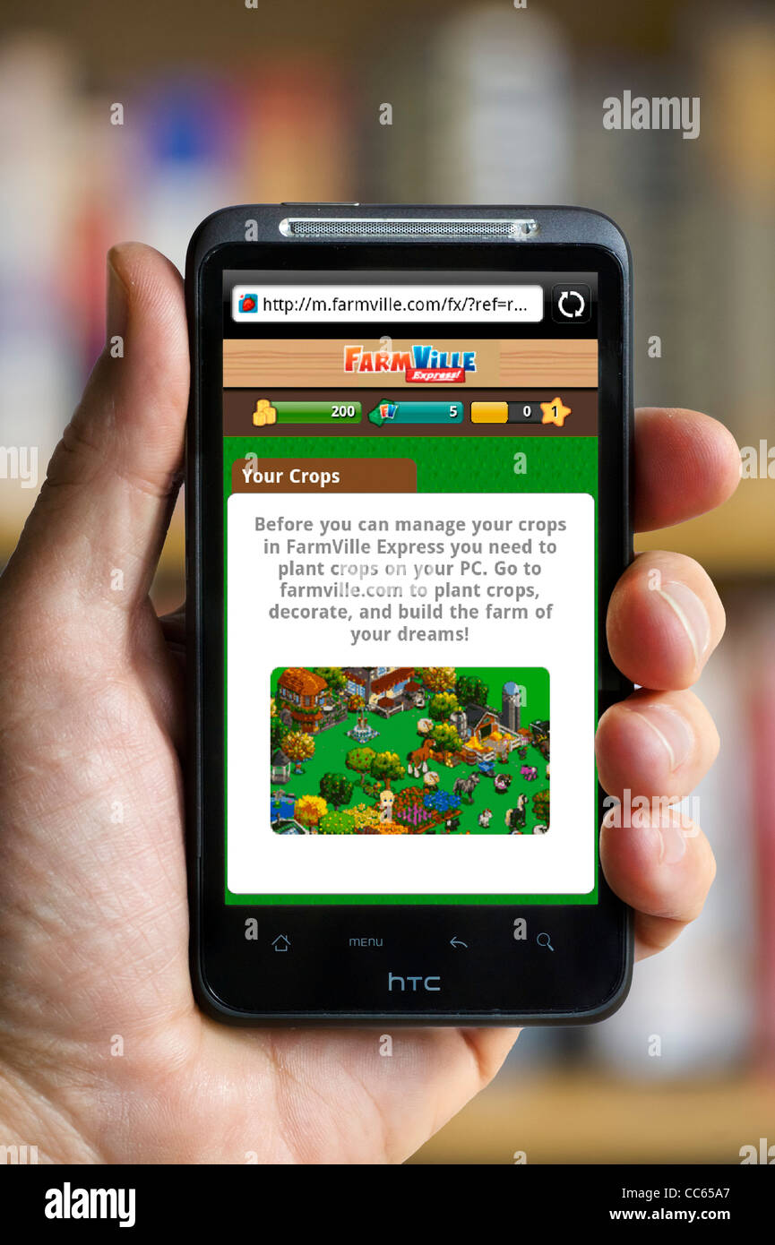 Zynga beliebten Farmville Spiel über Facebook auf einem HTC-smartphone Stockfoto