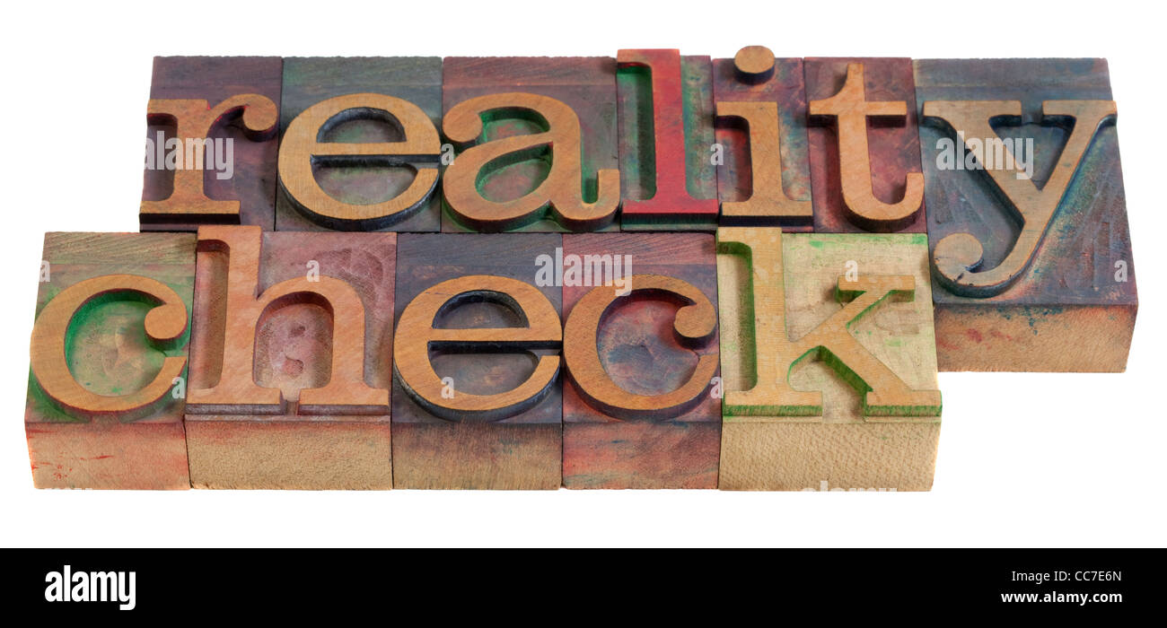 Reality Check-Konzept - Wörter in Vintage Holz Buchdruck Druckstöcken, gefärbt durch Farbe Tinten, isoliert auf weiss Stockfoto
