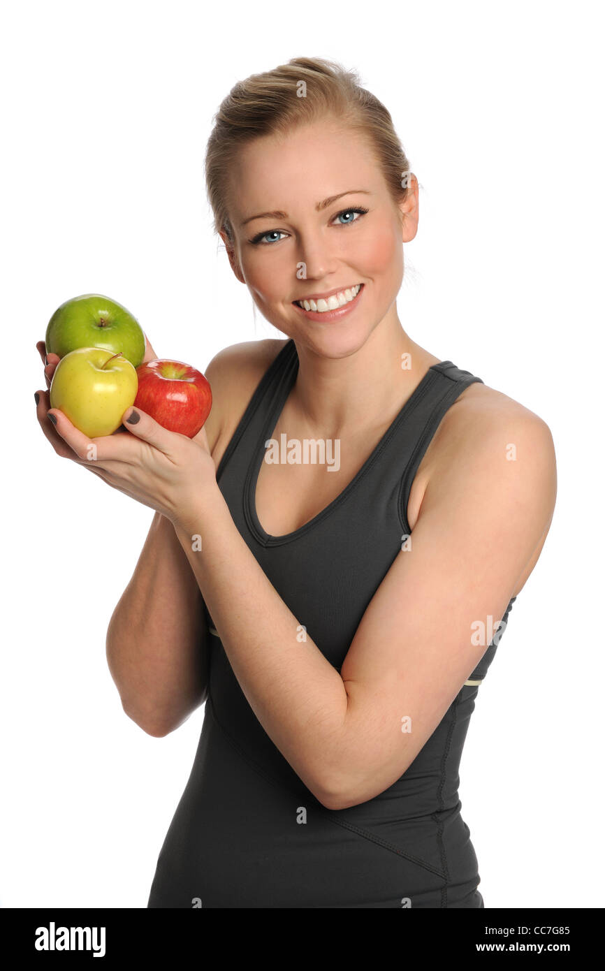 Schöne junge Frau, die mit frischen Äpfeln isoliert auf weißem Hintergrund Stockfoto