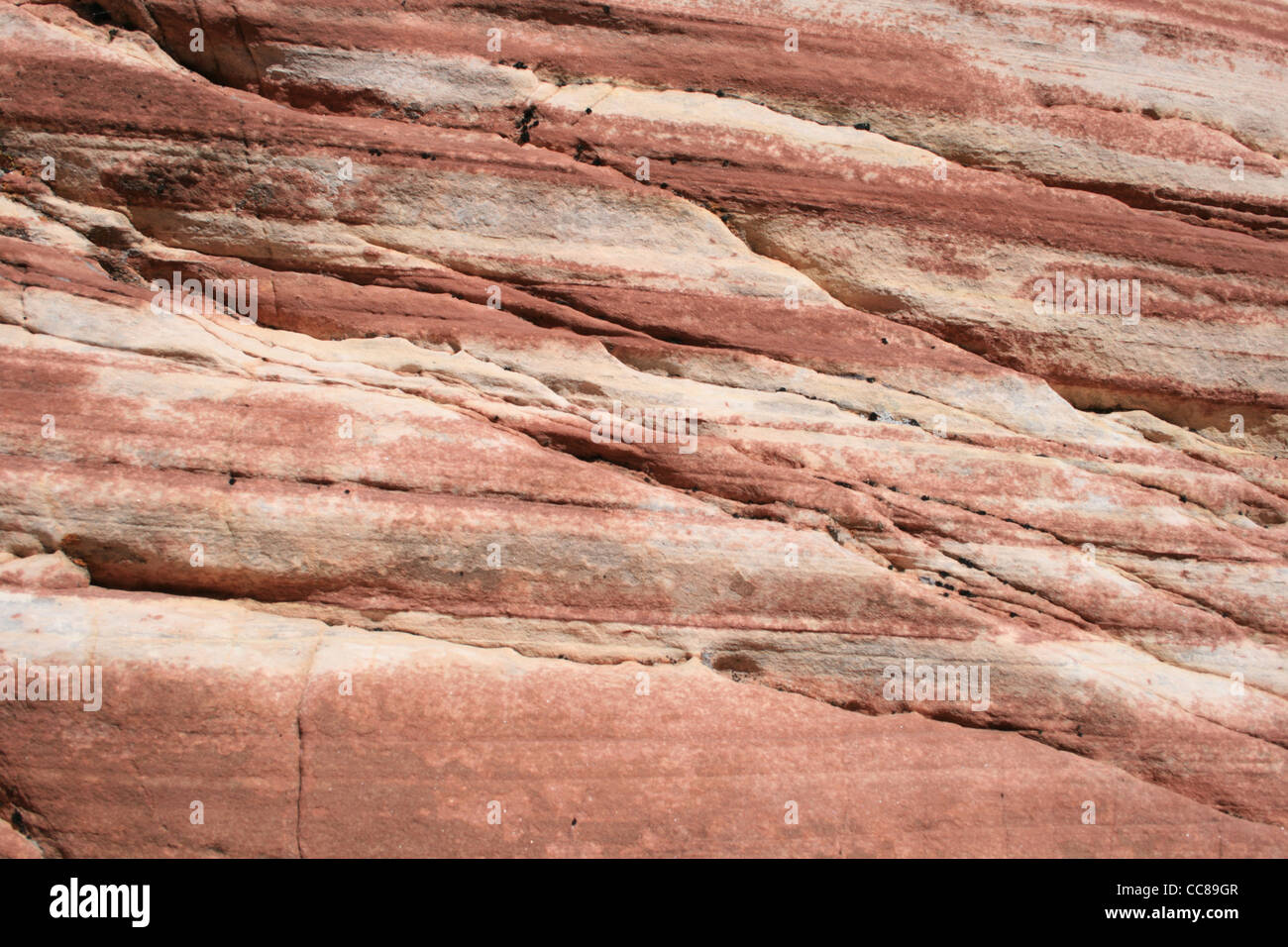 Sandstein-Hintergrund-Oberfläche mit Schichten und Risse Stockfoto
