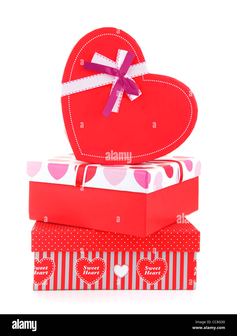 Roten romantische Geschenk-Boxen, die isoliert auf weißem Hintergrund, Konzeptbild von Liebe & Feier Stockfoto