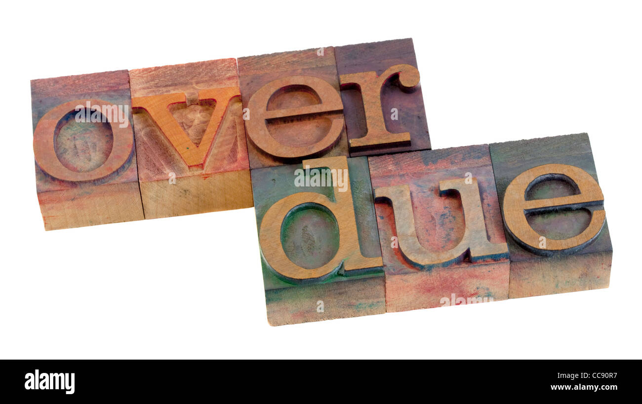 überfällige Wort in Vintage Holz Buchdruck Druckstöcken, befleckt von Farbtinte, isoliert auf weiss Stockfoto